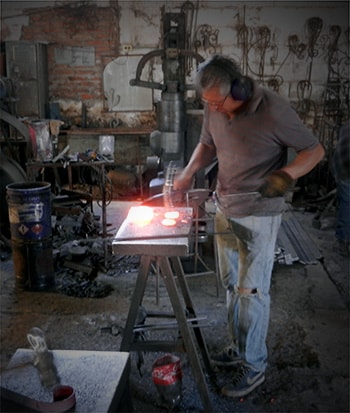 Trey Baumgarner working in his furniture shop